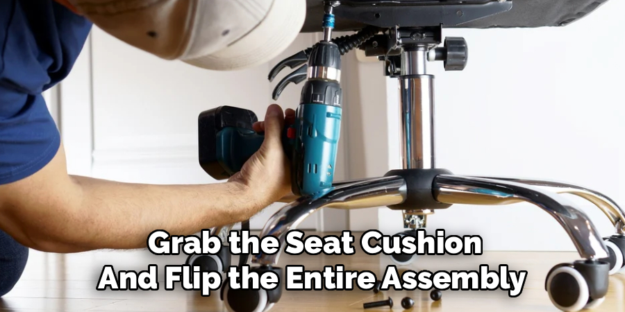 Grab the Seat Cushion
And Flip the Entire Assembly 