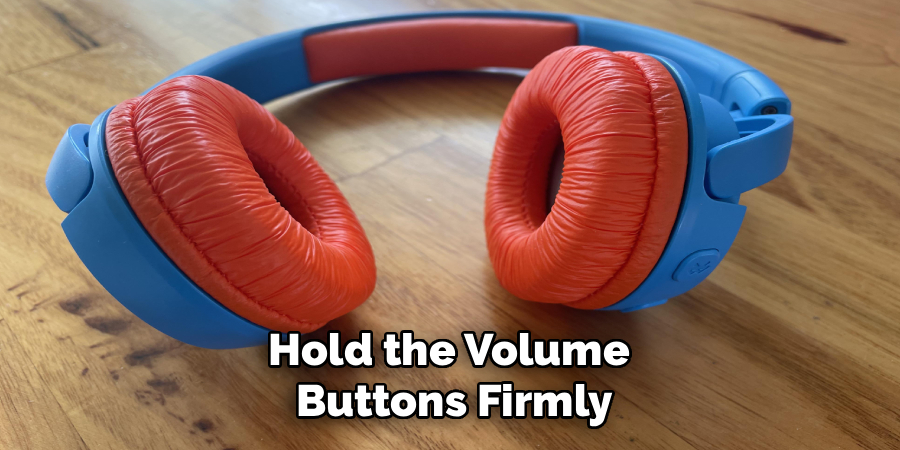 Hold the Volume
 Buttons Firmly