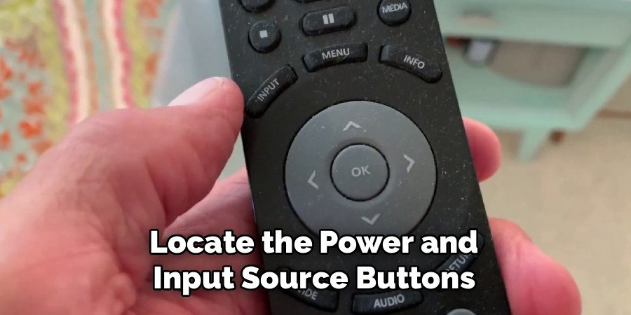 Locate the Power and Input Source Buttons