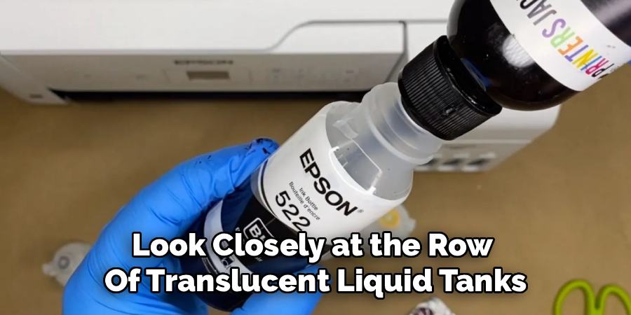 Look Closely at the Row 
Of Translucent Liquid Tanks