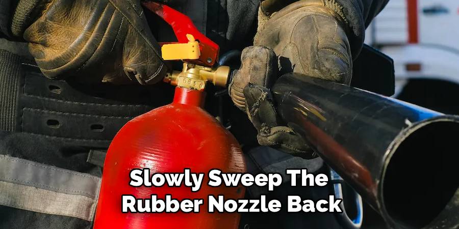 Slowly Sweep The 
Rubber Nozzle Back